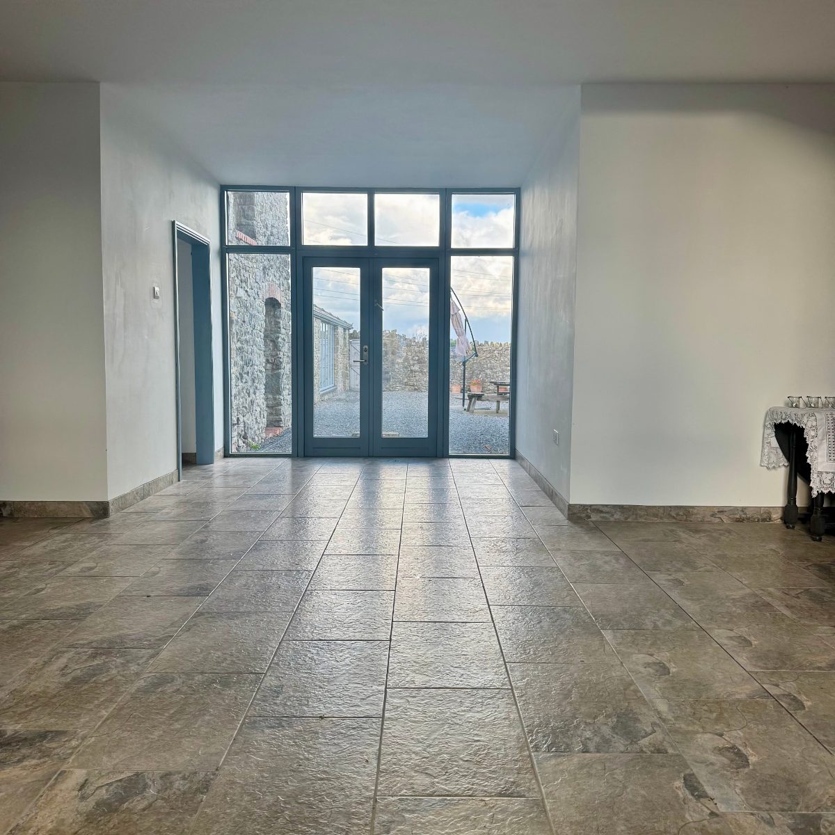 Stone floor in a barn conversion, by the rear doors