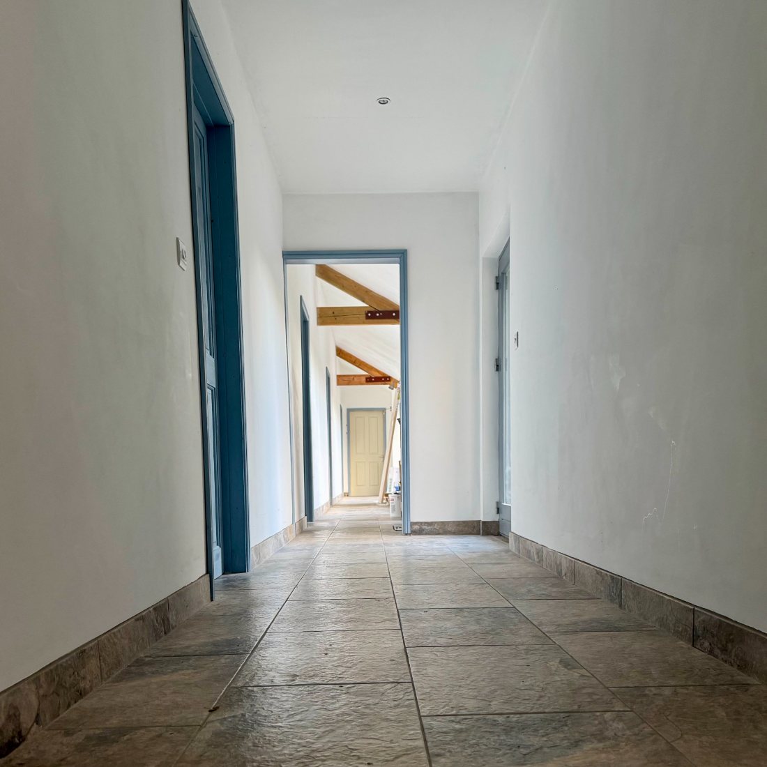 Slate floor with matching tiled skirting
